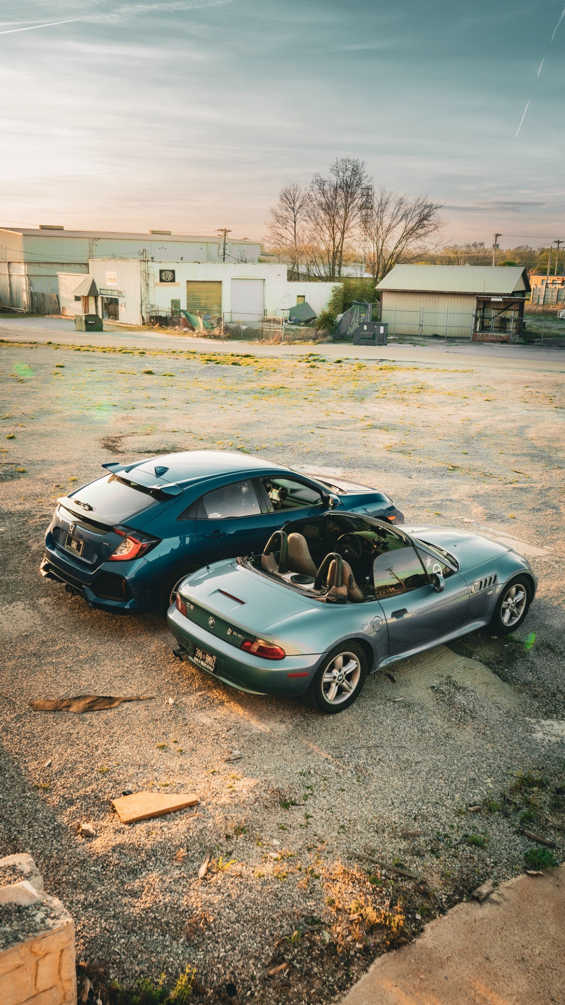 BMW Z3 and Honda Civic photographed together at golden hour
